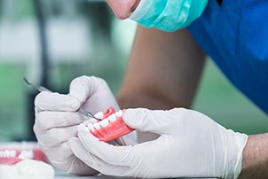 A lab technician working on some dentures